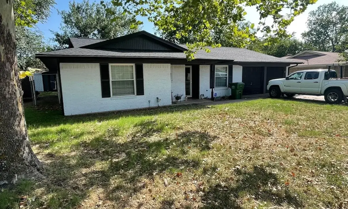 Professional roofing crew working on a residential roof in Berkeley